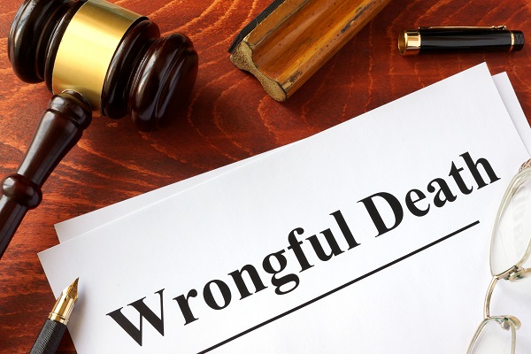 Document with title Wrongful Death on a wooden surface.